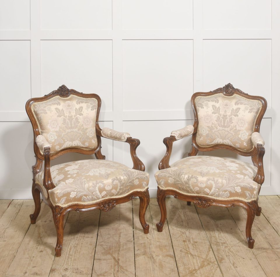 Pair of French Louis XV Style Carved Walnut Armchairs