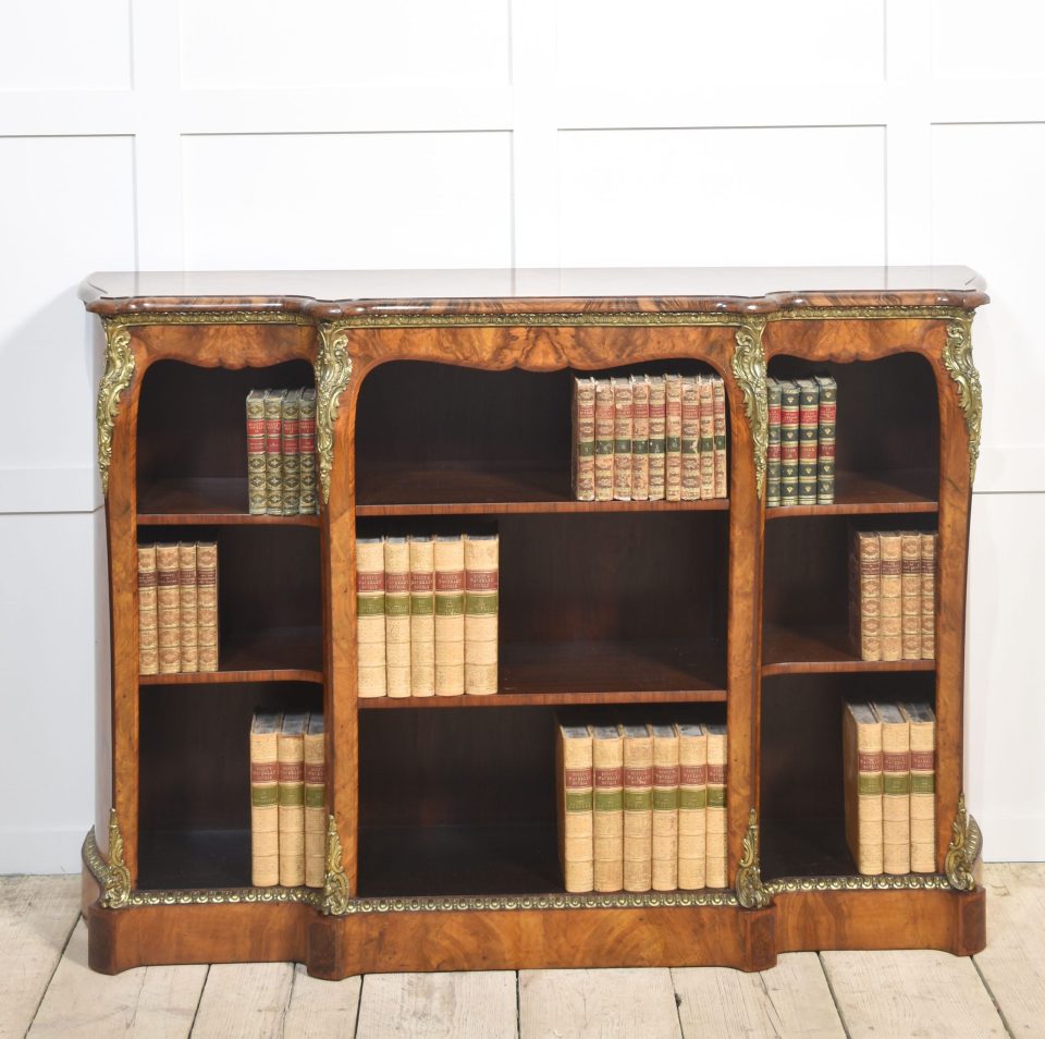 Gilt metal mounted walnut breakfront open bookcase
