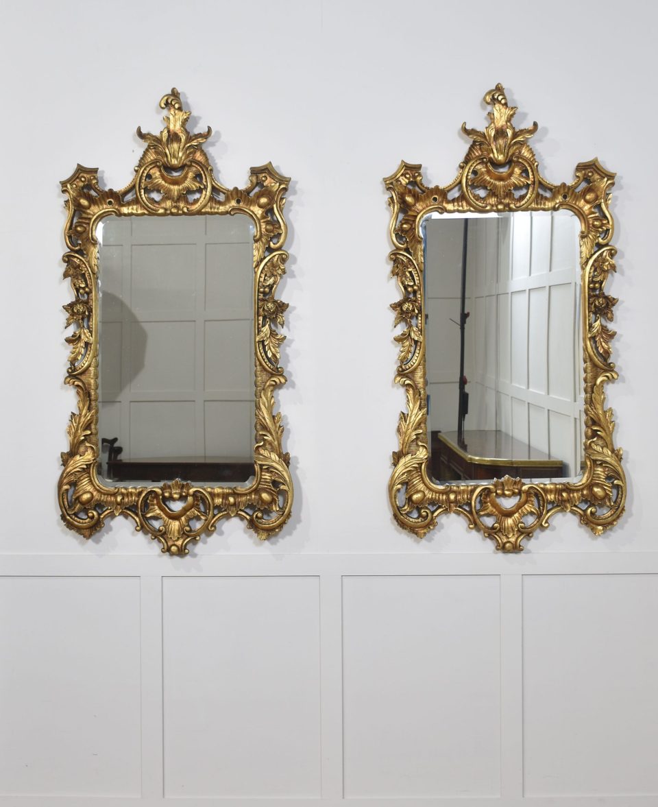 Pair of baroque style carved and gilded mirrors