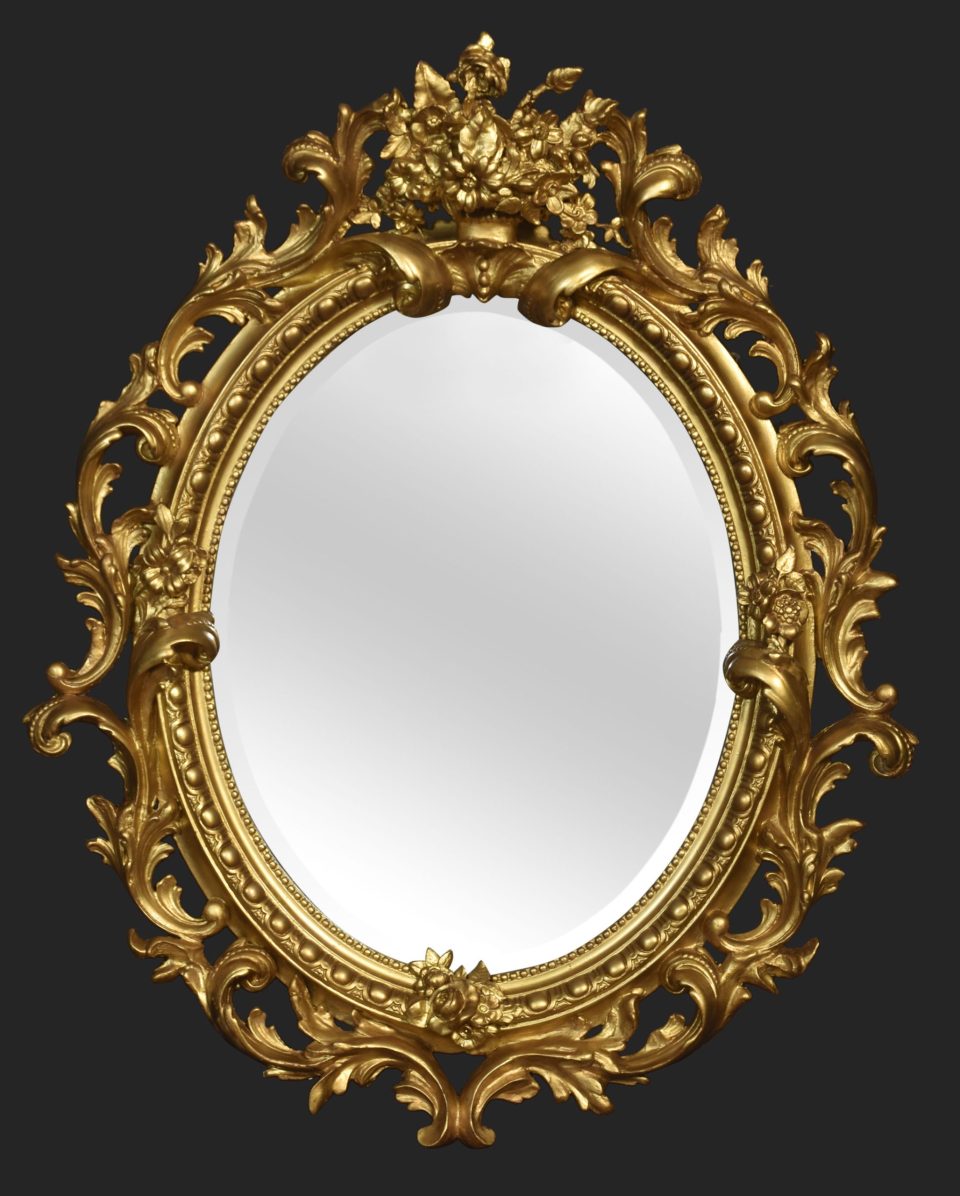 Carved gilt-wood oval wall mirror