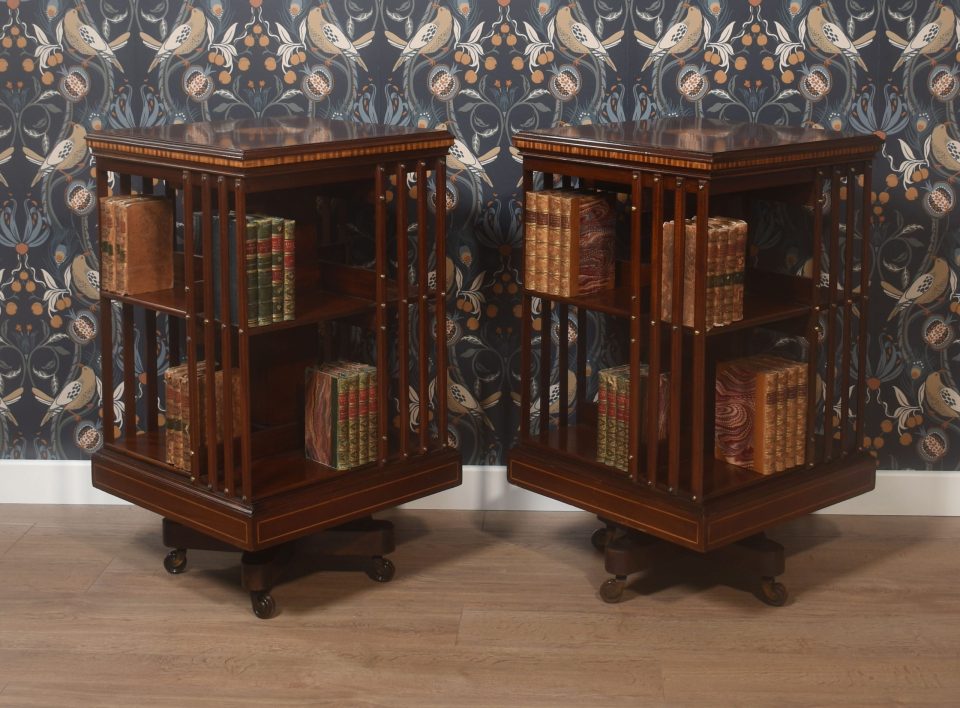 Pair of mahogany inlaid revolving bookcases by Maple and Co