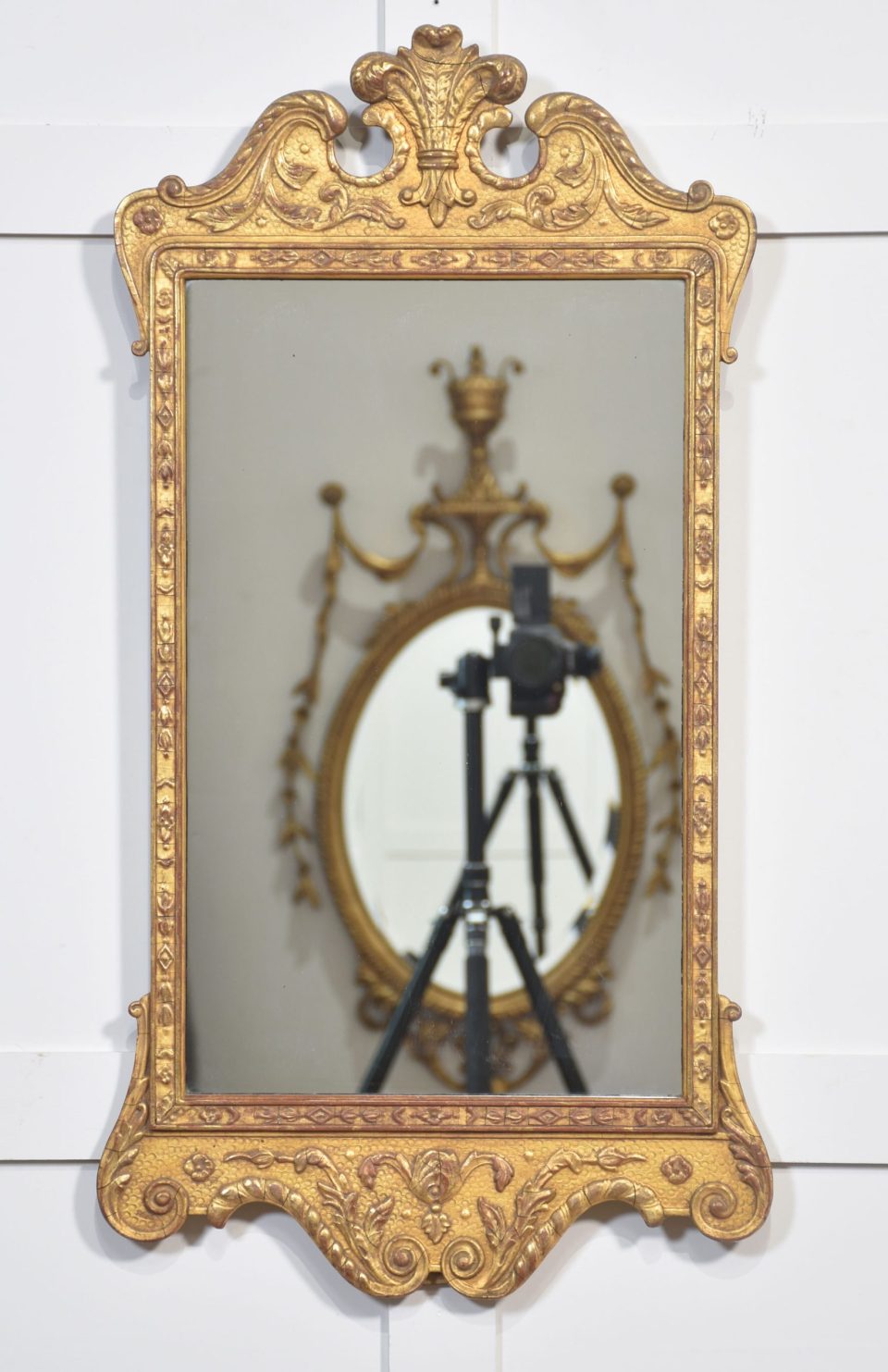 Carved giltwood wall mirror
