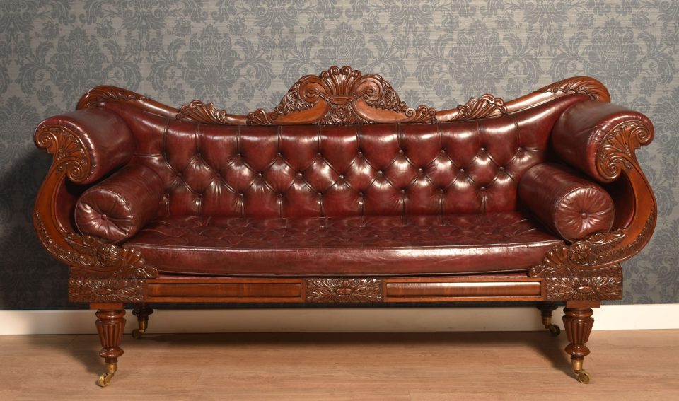 Early 19th century mahogany framed scroll end settee