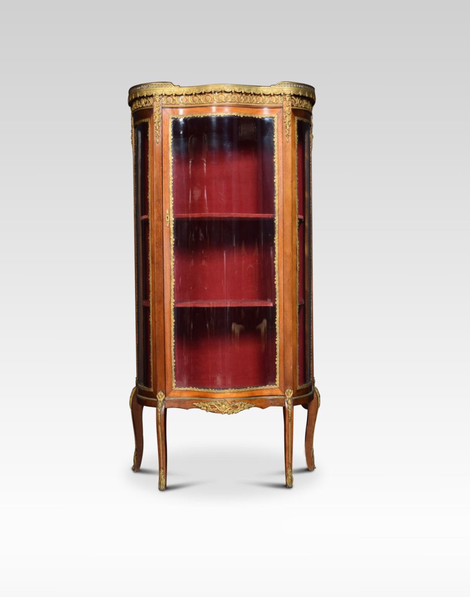 Serpentine fronted display cabinet of small proportions