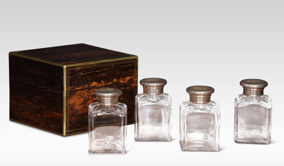 Set of four coromandel cased cologne bottles