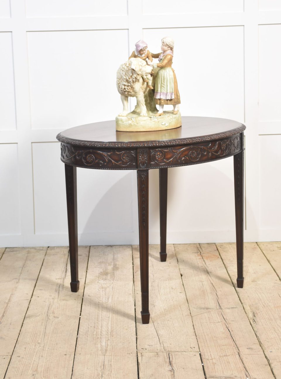 Carved mahogany occasional table