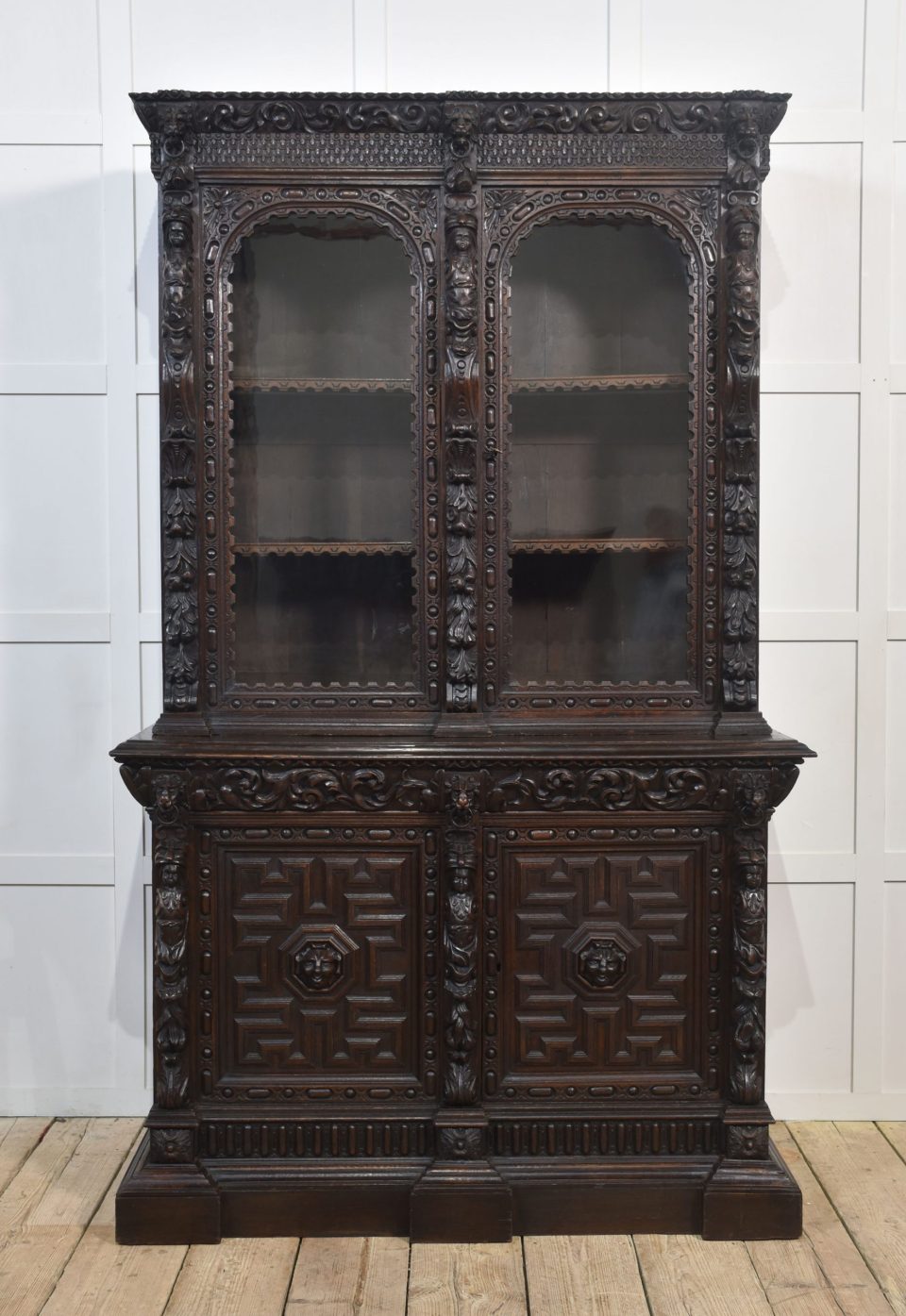 Renaissance revival carved oak two door bookcase