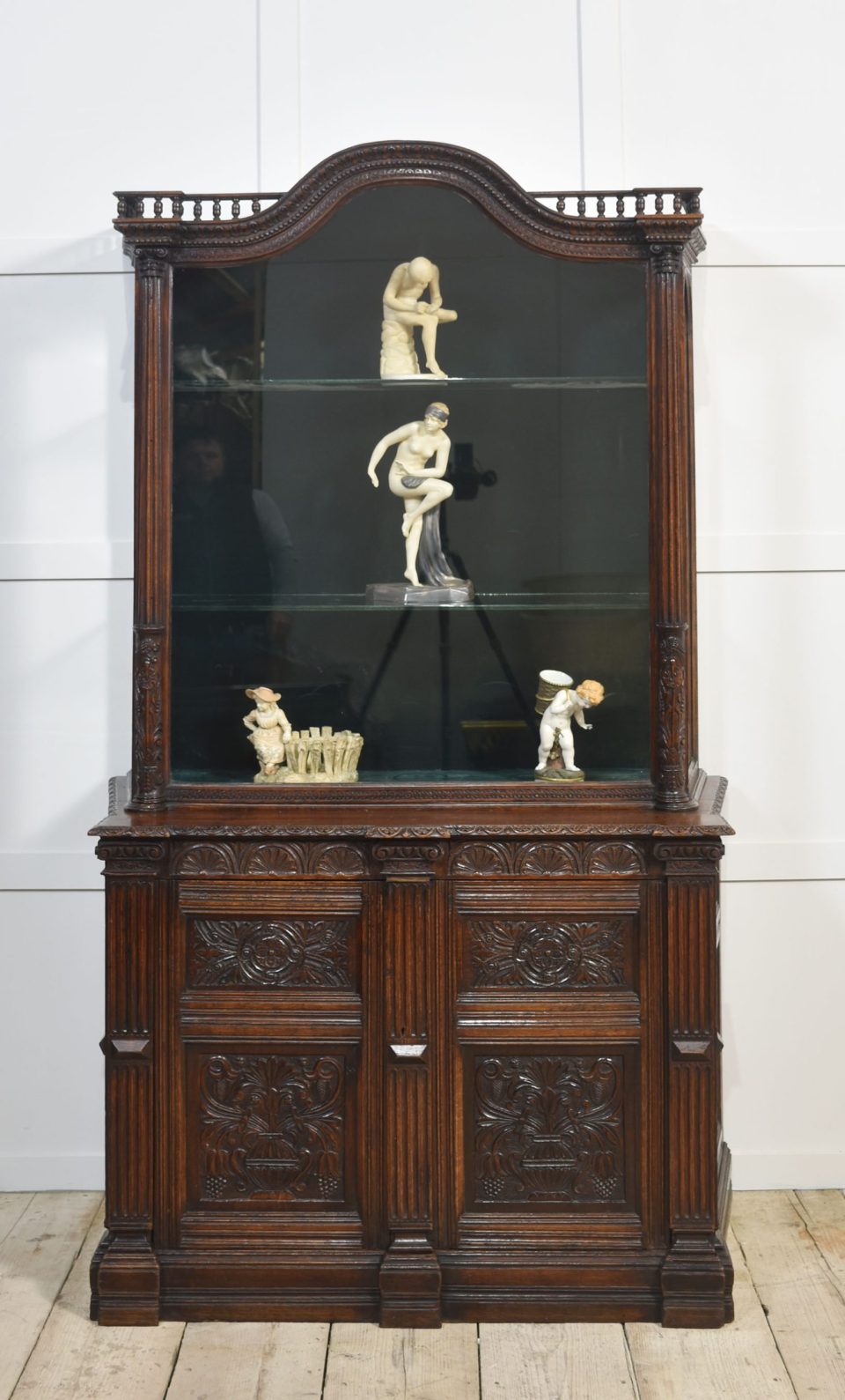 Carved oak display cabinet
