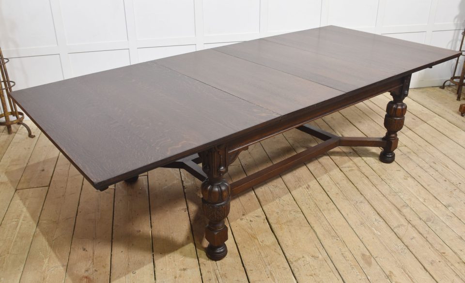 Oak extending dining table by Maple and Co