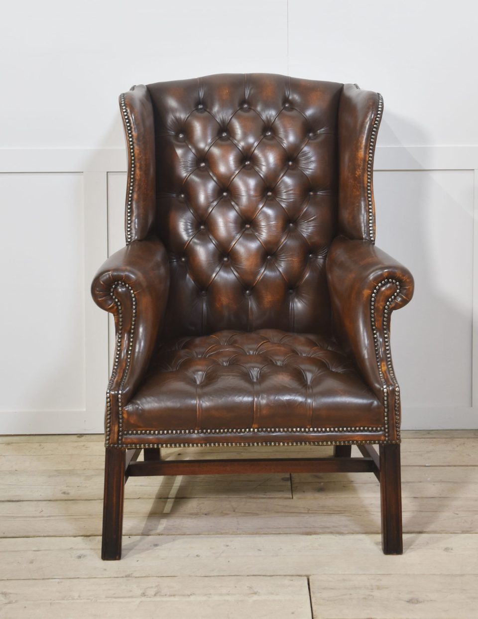 Leather upholstered wingback armchair