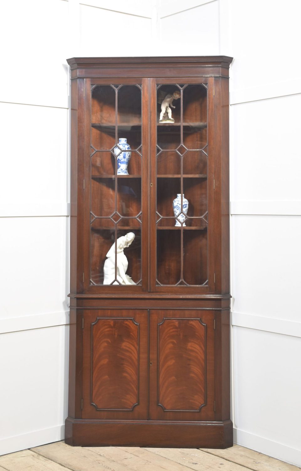 Mahogany glazzed corner cupboard